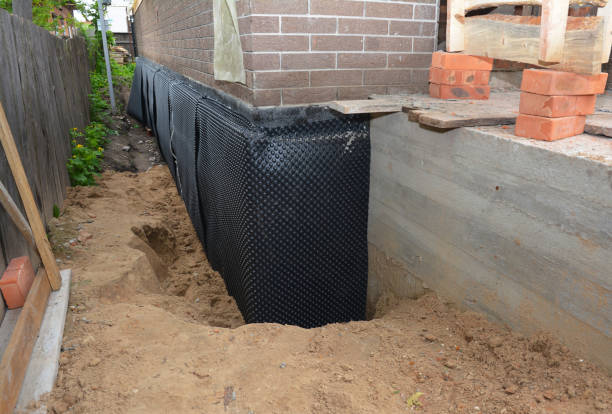 Happy homeowners after waterproofing job in Mount Airy